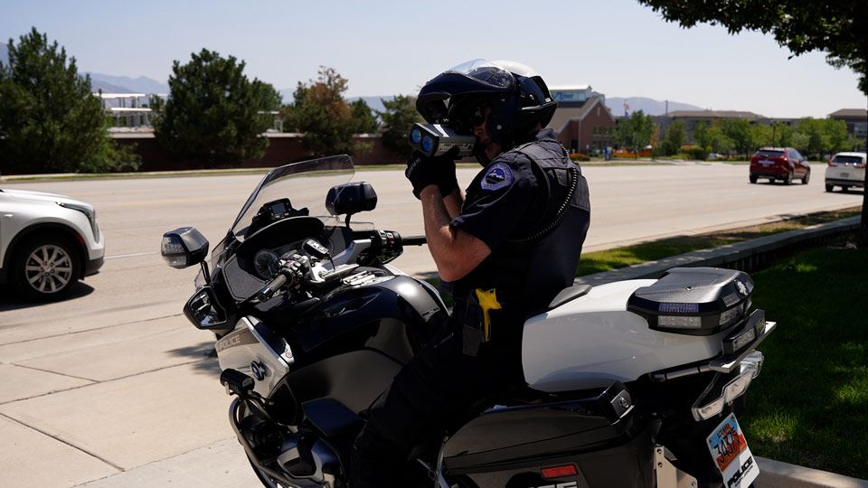 Motor Officer conducting speed enforcement using a Lidar device